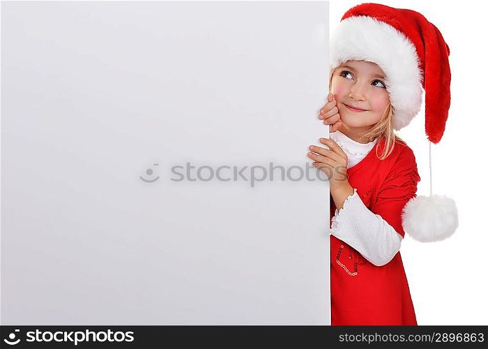 little girl in red santa hat peeking from billboard.