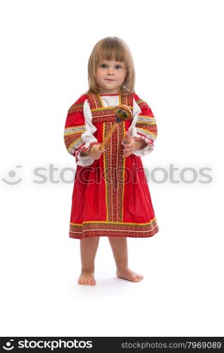 Little girl in red traditional dress with a wooden spoon. Isolate on white.