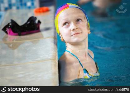 little girl in the pool at workout