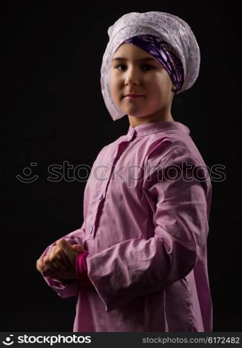 Little girl in traditional muslim clothes