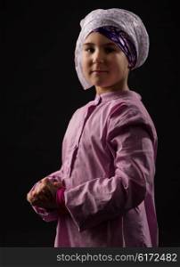 Little girl in traditional muslim clothes