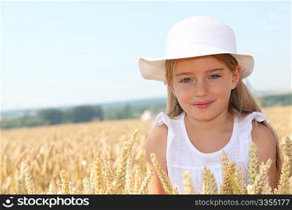 Little girl in wheat field