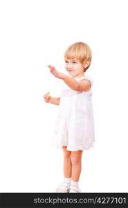 Little girl in white dress with bagel, isolated