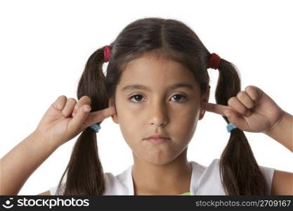 Little girl is closing her ears with her fingers