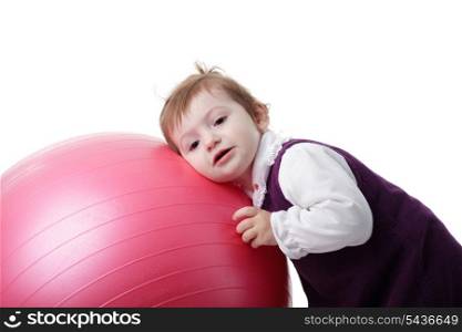 Little girl is playing with fitball isolated on white