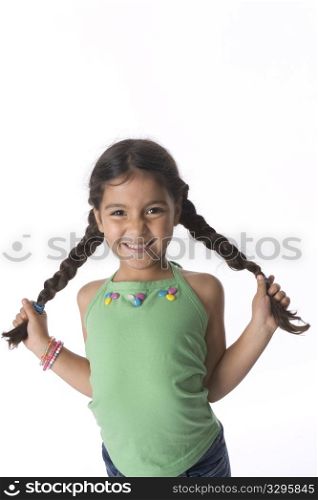 Little Girl Is Showing Her Pigtails With A Timid Expression