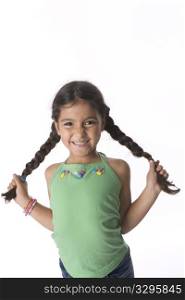 Little Girl Is Showing Her Pigtails With A Timid Expression