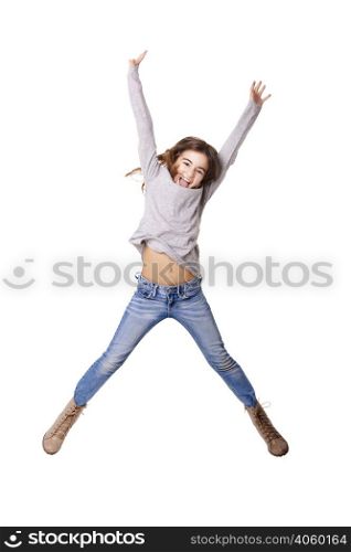 Little girl jumping over a white background