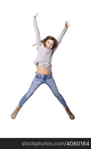 Little girl jumping over a white background