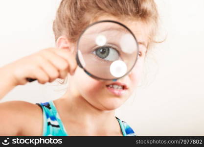 Little girl kid looking through magnifying glass.. Sweet cute little girl kid looking through magnifying glass.