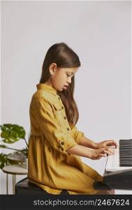 little girl learning how play electronic keyboard home 4