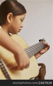 little girl learning how play guitar home 2