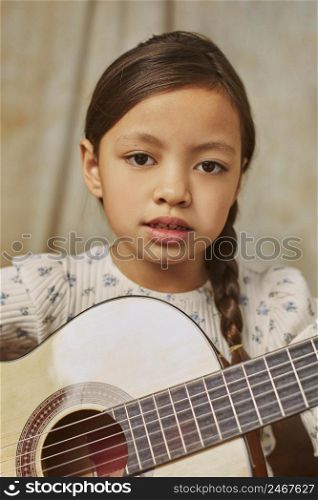 little girl learning how play guitar home 3