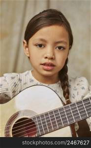 little girl learning how play guitar home 3
