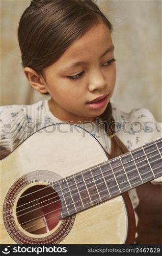 little girl learning how play guitar home 5