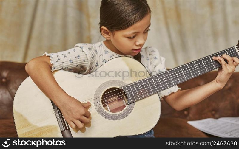little girl learning how play guitar home 6
