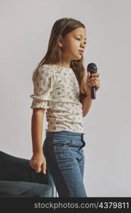 little girl learning how sing home
