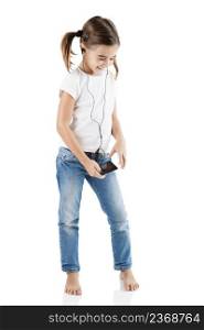 Little girl listen music with a MP3 player, isolated on white
