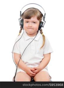 little girl listens music in ear-phones