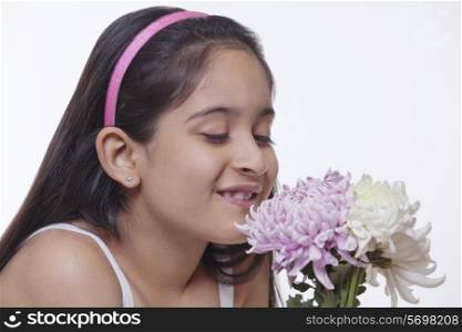 Little girl looking at flowers
