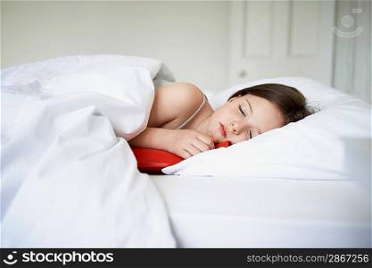 Little Girl Lying in Bed a Hot Water Bottle