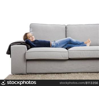 Little girl lying on a couch and resting