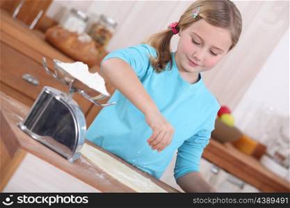 little girl making pancakes