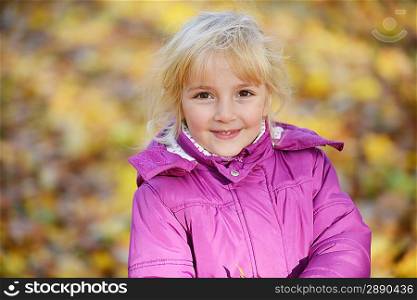 little girl on autumn leafs background