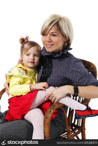 Little girl on hands for a young mother in a wicker chair on the white background
