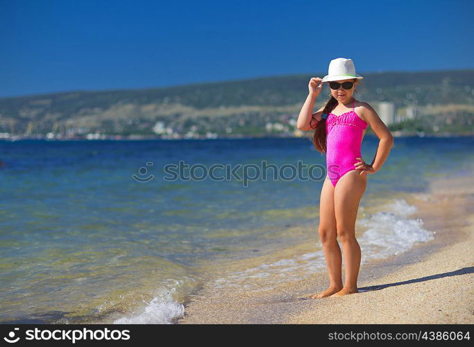 Little girl on sea coast