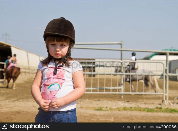 Little girl on the horse ranch