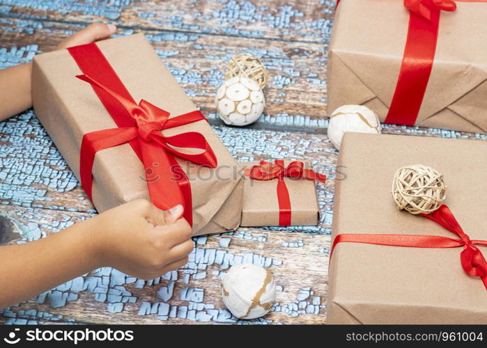 Little girl opening presents on Christmas day