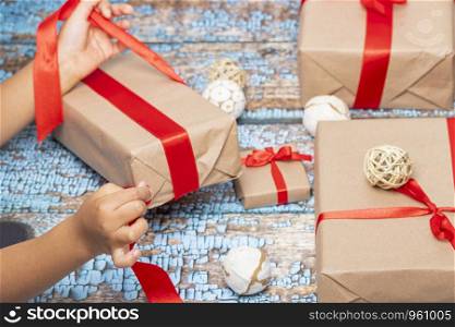 Little girl opening presents on Christmas day