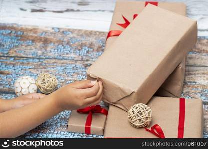 Little girl opening presents on Christmas day