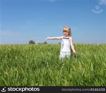 little girl outdoors in sunny summer day