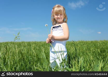 little girl outdoors in sunny summer day