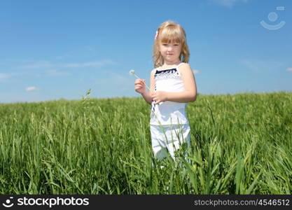 little girl outdoors in sunny summer day