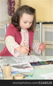Little girl painting