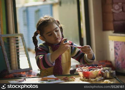 Little girl painting