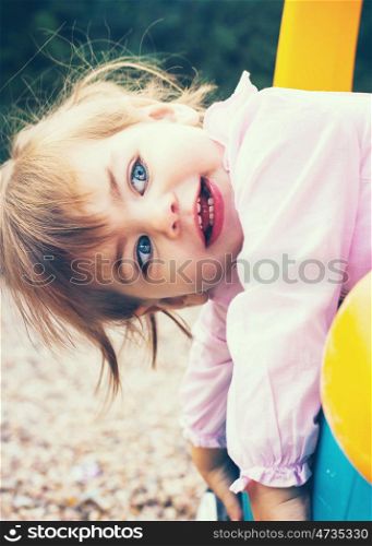 Little girl playing at the park