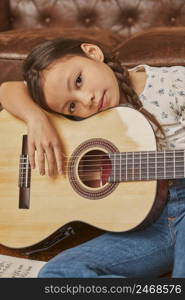 little girl playing guitar home 3