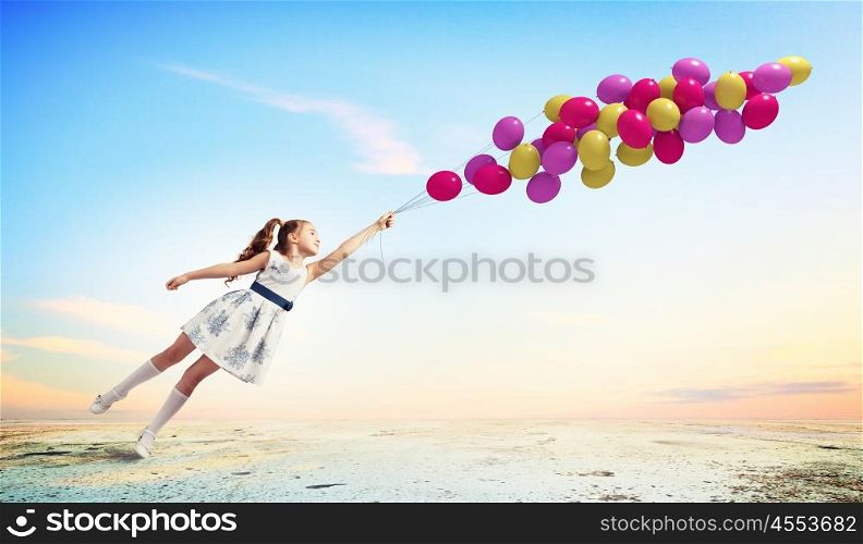 Little girl playing. Image of little pretty girl playing with balloons