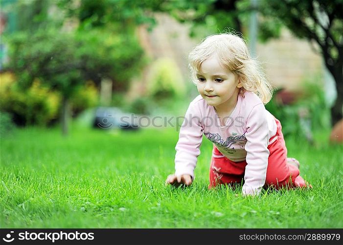 little girl playing in park
