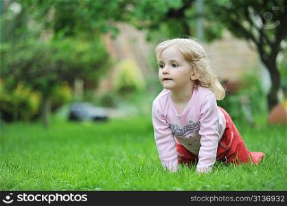 little girl playing in park