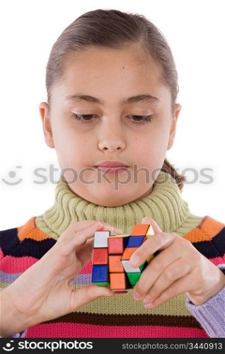 Little girl playing with a colorfull cube isolated over white