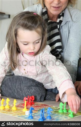 Little girl playing with grandma