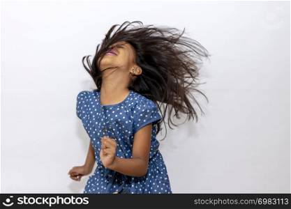 Little girl playing with her hair