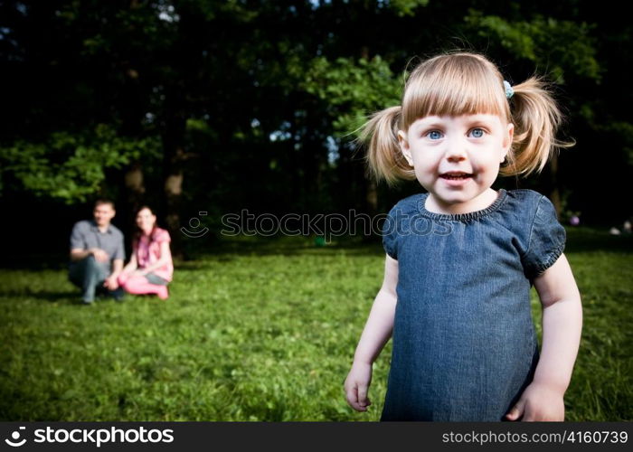 Little Girl Portrait On The Natire Background