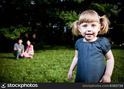 Little Girl Portrait On The Natire Background