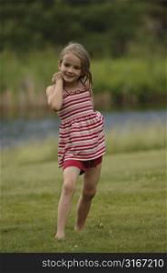 Little girl posing in a field